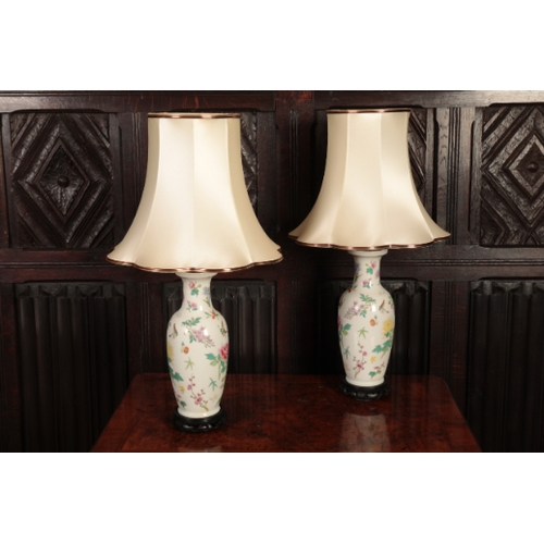 332 - A PAIR OF CHINESE STYLE PORCELAIN TABLE LAMPS

decorated with butterflies and flowers, fitted for el... 