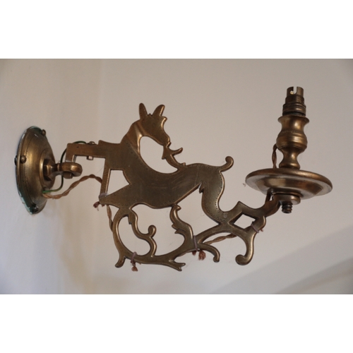 333 - A BRASS WALL LIGHT

with two arms designed as running deer, fitted for electricity; and two other wa... 