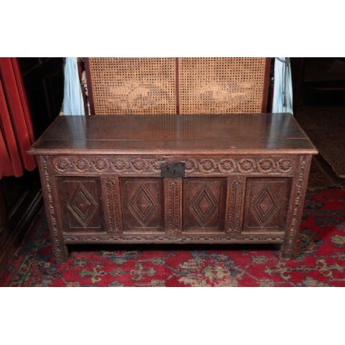 347 - A CHARLES II OAK JOINED COFFER

with a guilloche-carved frieze above four panels carved with lozenge... 