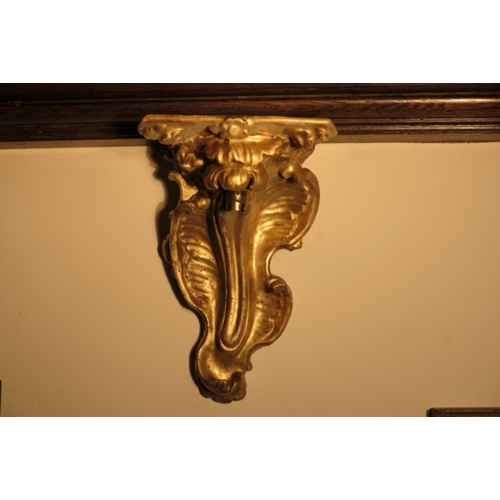 356 - A PAIR OF ROCOCO GILTWOOD WALL BRACKETS

carved with naturalistic flowers and rocaille-work, now inv... 