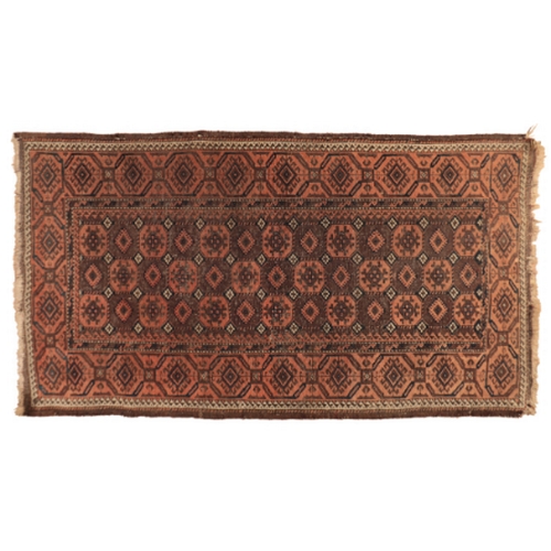 373 - A BOKHARA STYLE MAT

in shades of brown, orange and cream, with a central field containing conjoined... 