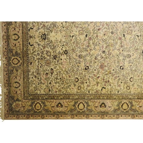 415 - A NORTH WEST PERSIAN STYLE RUG

20th century, the cream ground decorated with all over floral patter... 