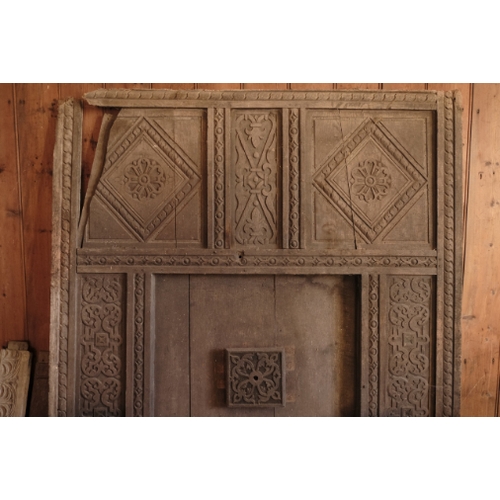 465 - AN OAK DOOR FRAME

with Gothic arch and strap hinges (approx. 204 cm high x 94cm wide); an ornate pi... 