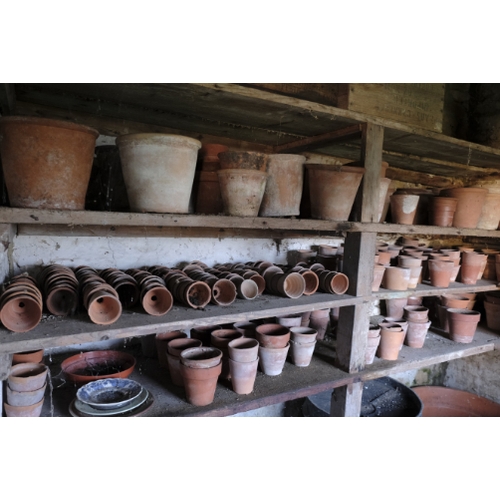 470 - A COLLECTION OF TERRACOTTA FLOWER POTS

of varying sizes from 6cm to 38cm diameter; two terracotta c... 