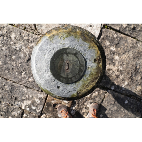 476 - A STONE SUN DIAL

with a bronze dial, 15cm diameter, on a baluster stone pedestal with a square base... 