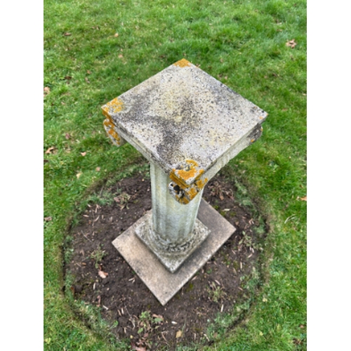 478 - A COMPOSITE STONE PLINTH

the square top over an ionic capital, fluted columns to stepped base, 100c... 