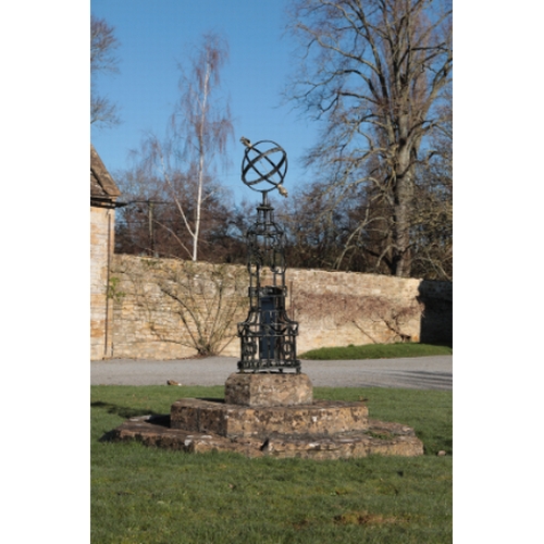 479 - A NEO-CLASSICAL BLACK PAINTED IRON AND PARCEL-GILT ARMILLARY SPHERE

decorated with ribbon-tied bows... 