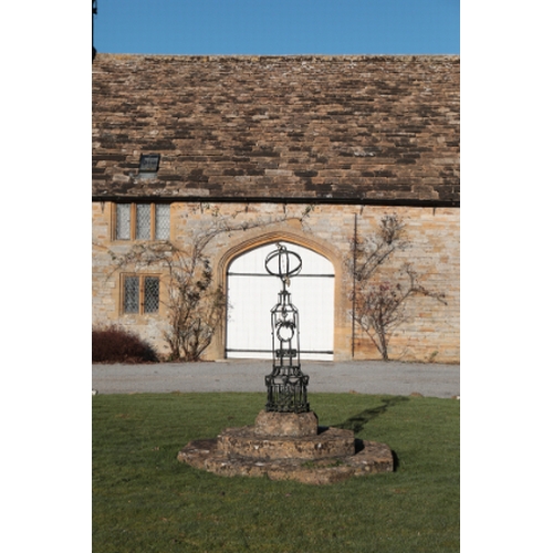 479 - A NEO-CLASSICAL BLACK PAINTED IRON AND PARCEL-GILT ARMILLARY SPHERE

decorated with ribbon-tied bows... 