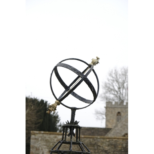 479 - A NEO-CLASSICAL BLACK PAINTED IRON AND PARCEL-GILT ARMILLARY SPHERE

decorated with ribbon-tied bows... 