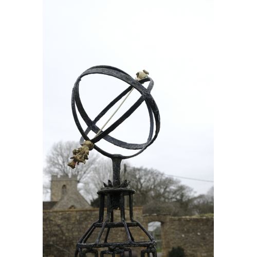 479 - A NEO-CLASSICAL BLACK PAINTED IRON AND PARCEL-GILT ARMILLARY SPHERE

decorated with ribbon-tied bows... 