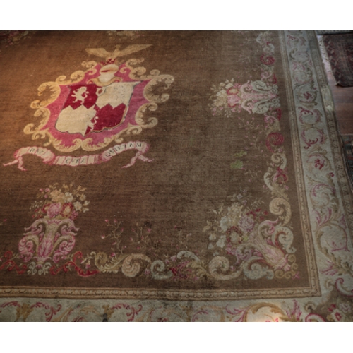 59 - AN IMPORTANT AXMINSTER HERALDIC CARPET

with a central armorial of the Medlycott family surmounted b... 