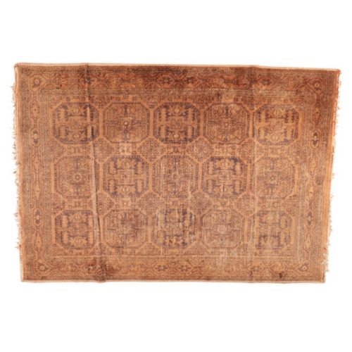 61 - A BOKHARA RUG

with a brick red field containing three rows of guhls within multiple foliate borders... 