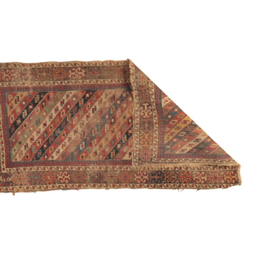 62 - A CAUCASIAN RUG

of bold geometric design, the rectangular field with triangular stripes containing ... 