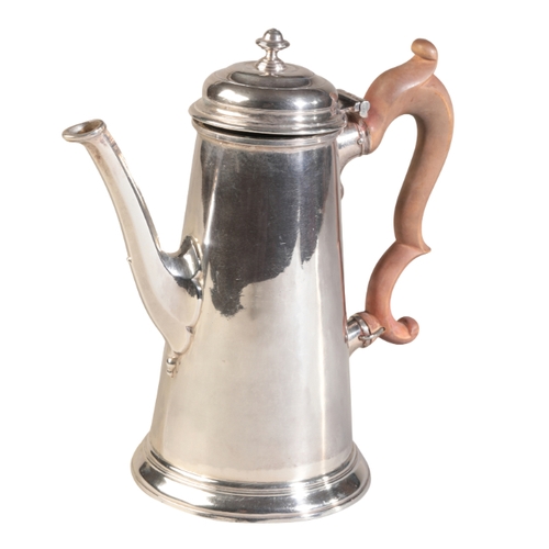 89 - A GEORGE II SILVER COFFEE POT

by Richard Bayley, London 1735, of plain cylindrical form with a wood... 