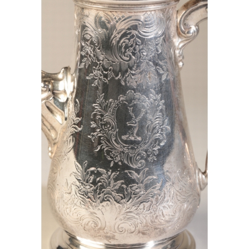 92 - A GEORGE II SILVER COFFEE POT

by Fuller White, London 1758, with chased floral decoration and carto... 