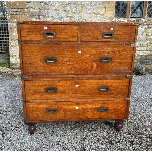 468 - A CAMPAIGN CHEST

with two short and three long drawers with brass inset handles and strap corners, ... 