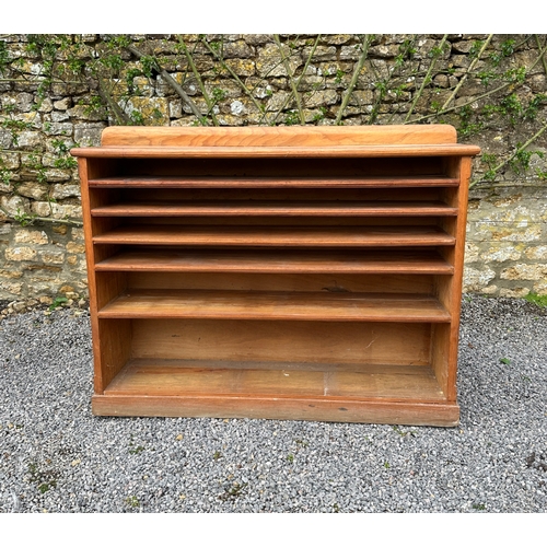 469 - A PINE DRESSER

20th century, the upper section with moulded cornice over shelves, plate dividers, a... 