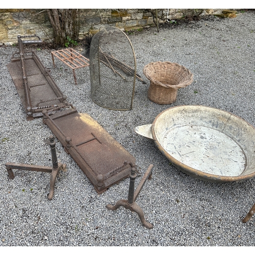 469a - A PAIR OF EARLY 19TH CENTURY WROUGHT IRON IMPLEMENT RESTS a 19th Century brass trivet; three Victori... 