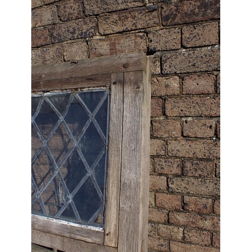 1 - A LARGE OAK-FRAMED CASEMENT WINDOW with leaded lights, and iron fittings 171cm high, 173.5cm wide (w... 