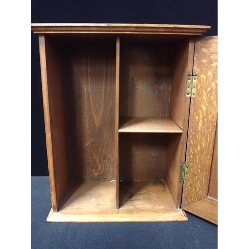 150 - AN OAK SMOKER'S CABINET, IN THE MANNER OF SHAPLAND & PETTER with a marquetry panel depicting an 18th... 