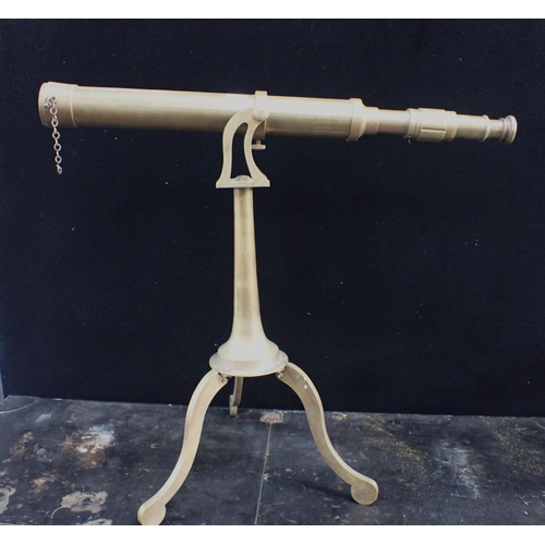 153 - A DECORATIVE BRASS TELESCOPE ON TRIPOD STAND and a Gieves military Japanned tin trunk 107cm long (2)