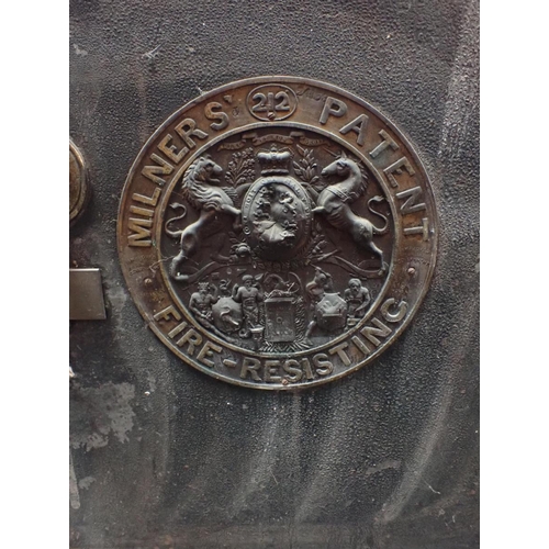 175 - AN ANTIQUE MILNER'S PATENT FIRE RESISANT SAFE with key, 71cm high x 56cm x 57cm (rusted at bottom)