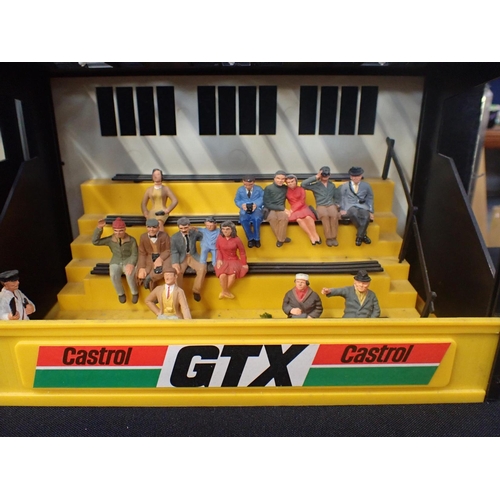 203 - 4 VINTAGE SCALEXTRIC GRANDSTANDS 2 Tag Heuer, 1 Castrol GTX and 1 Marlboro. 1 with seated figures an... 