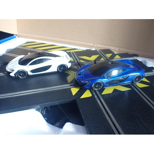 229 - AN INCOMPLETE SCALEXTRIX MCLAREN P1 SET comprising two cars and track, but lacking controllers, box ... 