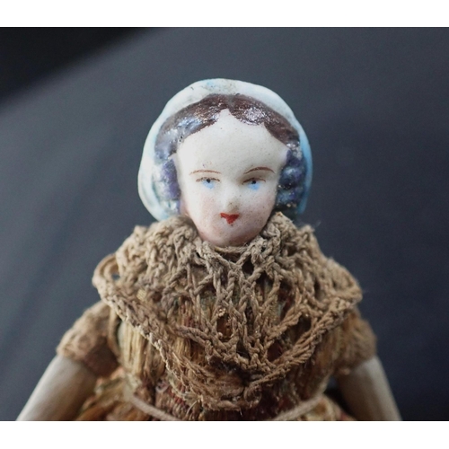 264 - A FRENCH BISQUE HEADED 'TOUPIE' SPINNING TOP DOLL the tin base stamped 'TOUPIE BREVETTE' (obscured),... 