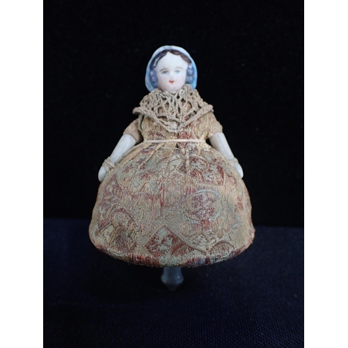 264 - A FRENCH BISQUE HEADED 'TOUPIE' SPINNING TOP DOLL the tin base stamped 'TOUPIE BREVETTE' (obscured),... 