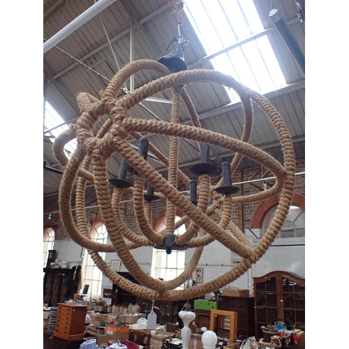 284 - A SPHERICAL ROPE CHANDELIER approx 77cm dia (one bulb holder a/f)