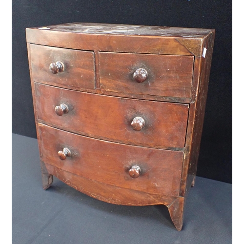 295 - A 19TH CENTURY MINIATURE BOW FRONT CHEST OF DRAWERS mahogany, two over two with turned knobs, 33cm w... 