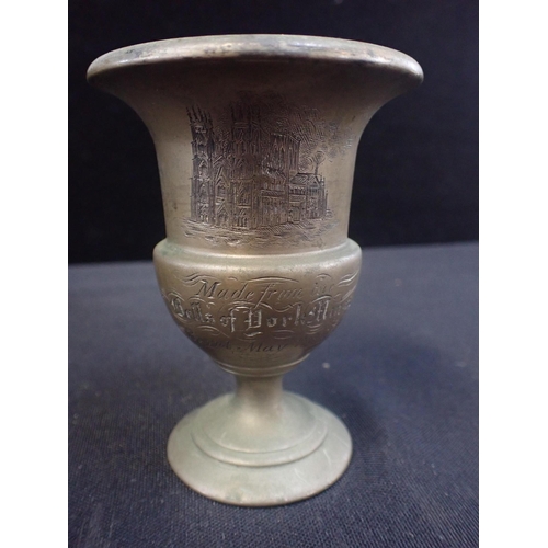 307 - AN URN; 'MADE FROM THE BELLS OF YORK MINSTER' 'Burnt May 20. 1840', engraved with a view of the mins... 