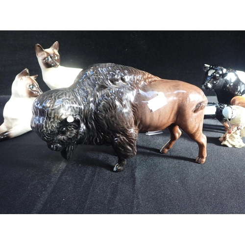 370 - A BESWICK POTTERY BISON and other Beswick figures, including Friesian cow 'Coddington Hilt Bar' (som... 