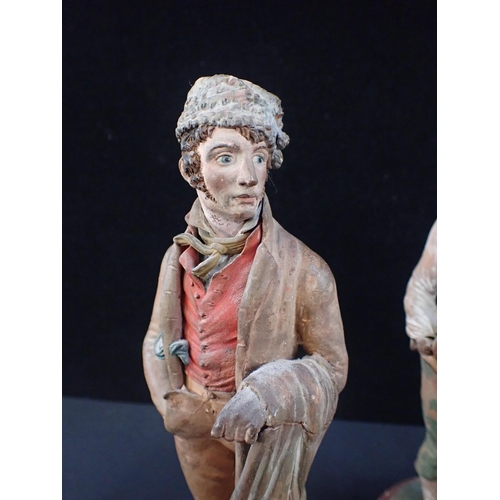 378 - PAIR OF EARLY 19th CENTURY TERRACOTTA FIGURES OF TRADESMEN possibly Breton, 28 cms high