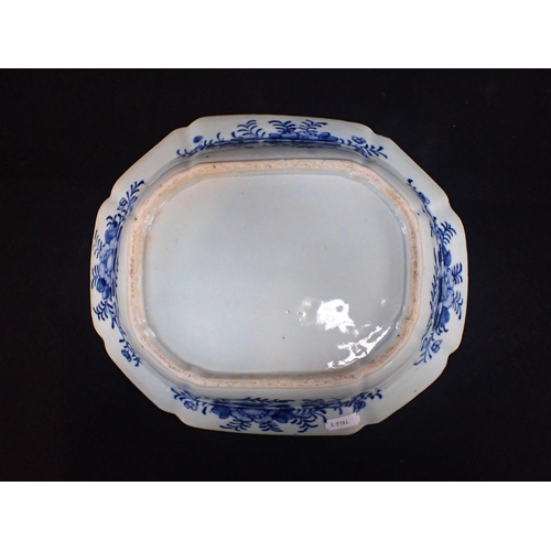 389 - A CHINESE EXPORT BLUE AND WHITE OCTAGONAL DISH painted with a garden scene within a floral border 28... 