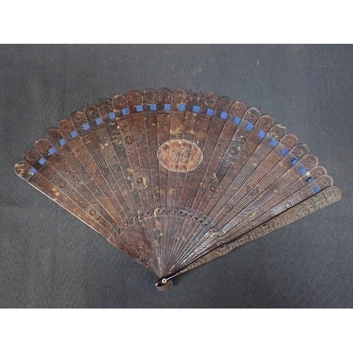 395 - A CANTONESE PIERCED AND CARVED TORTOISESHELL FAN with central initials 27cm long, 19th century