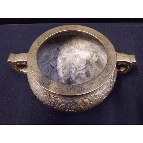 400 - A BRASS CENSER, WITH SCENES IN RELIEF with incised borders and handles, seal mark beneath (polished)... 