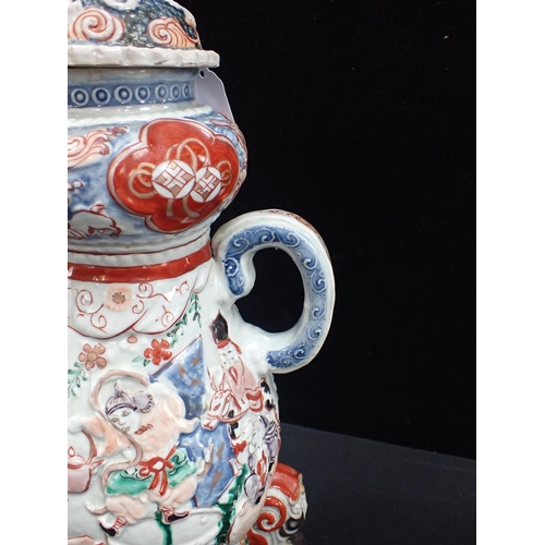 411 - A JAPANESE MOULDED IMARI COFFEE POT, EDO STYLE on three feet with cover, and hole for spigot, moulde... 