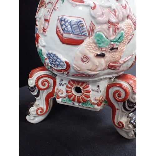 411 - A JAPANESE MOULDED IMARI COFFEE POT, EDO STYLE on three feet with cover, and hole for spigot, moulde... 