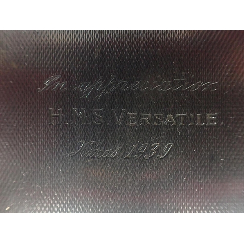 433 - AN ART DECO SILVER BACKED MIRROR inscribed; 'In appreciation H.M.S. VERSATILE X'mas 1939', with two ... 