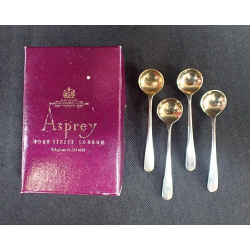 447 - ASPREY: A & Co. FOUR SILVER SALT SPOONS, LONDON 1975 in an Asprey box, a silver photo frame and a si... 