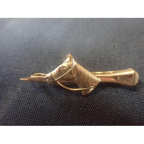 481 - THREE BAR BROOCHES including a horse bar brooch in gilt metal; together with a crop bar brooch and s... 