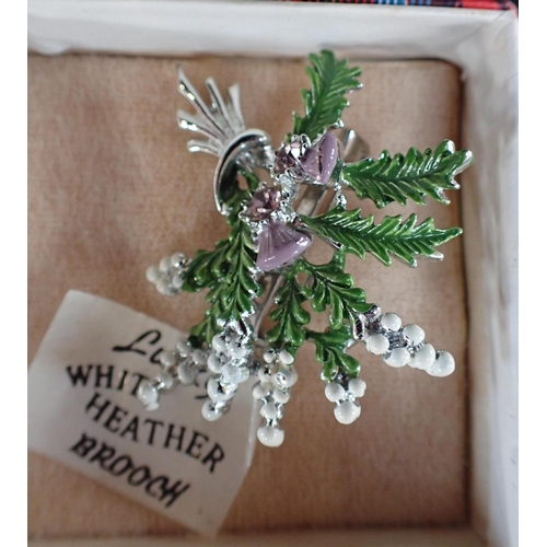 484 - A GEMSET THISTLE AND HEATHER BROOCH and a modernist flower pendant necklace