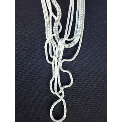 497 - A WHITE METAL MULTI-CHAIN TUBULAR NECKLACE