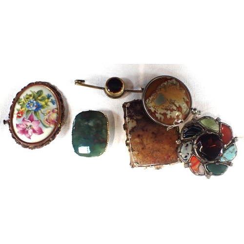 517 - A SELECTION OF COSTUME JEWELLERY including two agate brooches, all mounted to three canvases