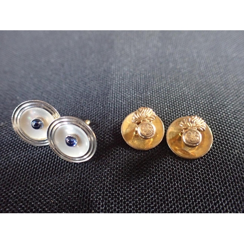 523 - TWO 18CT GOLD SHIRT STUDS the white gold faces inset with cabochon blue stones, two 9ct gold miltary... 