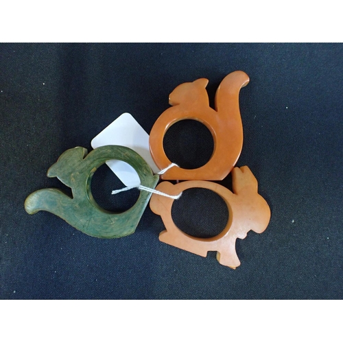 539 - THREE 1930s BAKELITE NAPKIN RINGS of animal form,; two squirrels and a rabbit