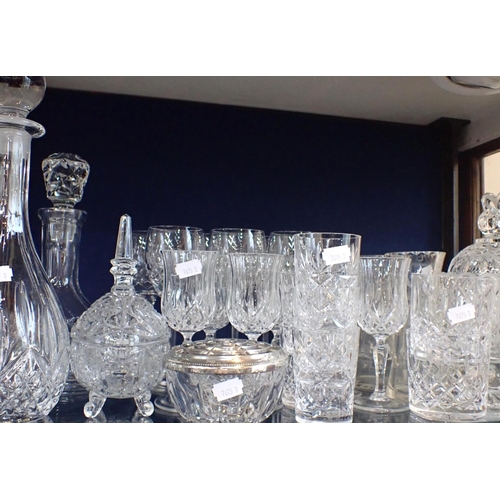 56 - A COLLECTION OF CRYSTAL GLASS including domestic glassware, decanters, dishes, rose bowls etc, some ... 