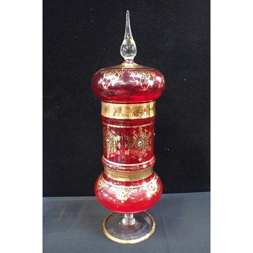 57 - A BOHEMIAN STYLE RED AND GILDED VASE AND COVER 43 cms high, with other glassware